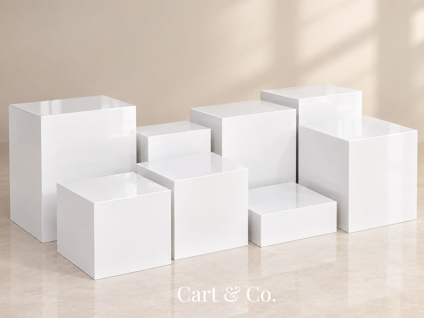 White Cart & Co. 8-piece acrylic riser set arranged in a staggered buffet display, staged for catering and event styling